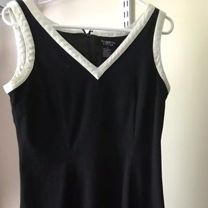 B. Moss black v-neck dress w/ white garnishing hem
